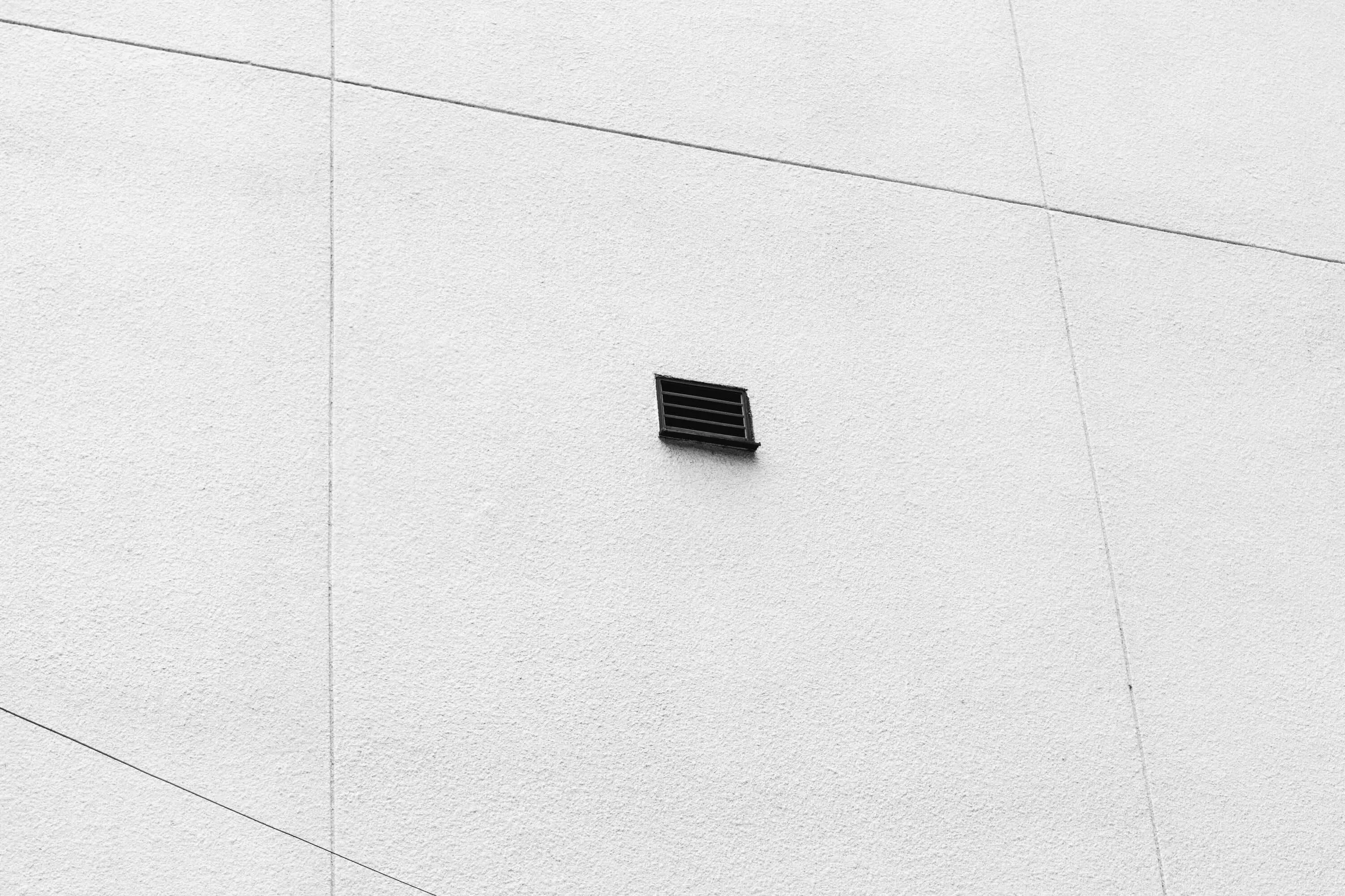 Fascade of drain on wall with tiles